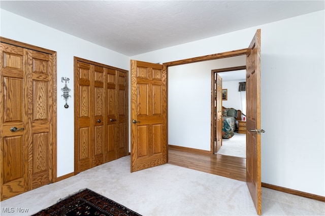 carpeted bedroom with baseboards