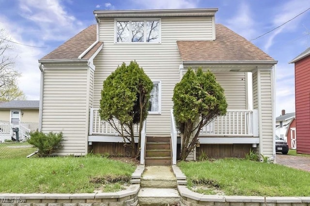 503 Rothrock Ave, Akron, OH 44314 - view of front of home with a shingled roof and fence