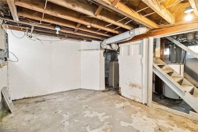 unfinished basement featuring stairway