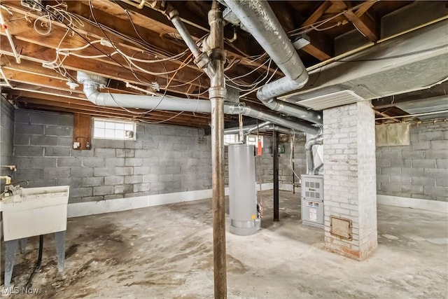 below grade area with a sink and gas water heater