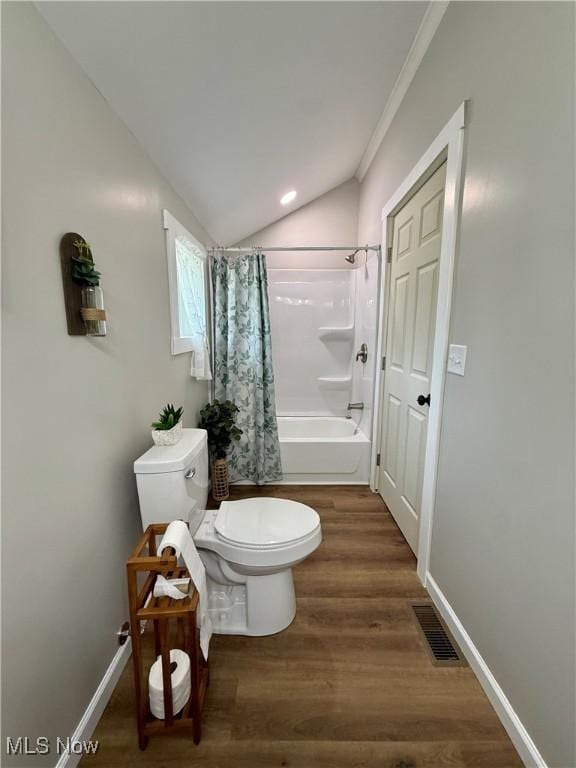 222 Smith St, Niles, OH 44446 - bathroom with shower / bath combo, toilet, visible vents, wood finished floors, and crown molding