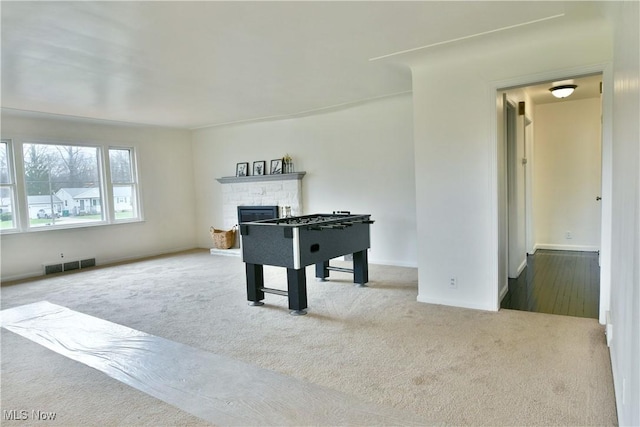 5099 Norquest Blvd, Youngstown, OH 44515 - rec room featuring baseboards, carpet flooring, a stone fireplace, and visible vents
