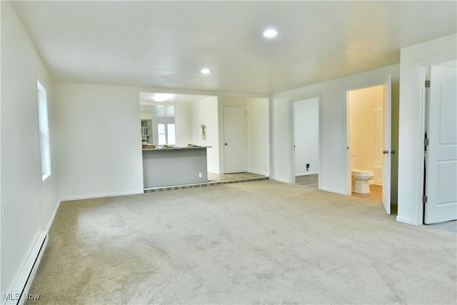 5099 Norquest Blvd, Youngstown, OH 44515 - unfurnished living room featuring baseboard heating, baseboards, carpet floors, and recessed lighting