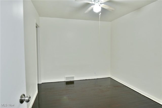 5099 Norquest Blvd, Youngstown, OH 44515 - spare room with dark wood-type flooring, visible vents, baseboards, and ceiling fan