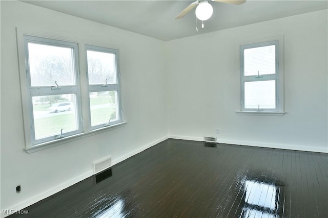 5099 Norquest Blvd, Youngstown, OH 44515 - spare room featuring dark wood finished floors, visible vents, baseboards, and ceiling fan