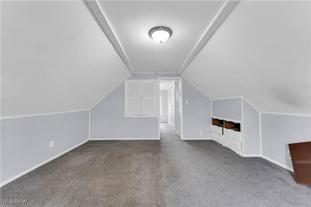 additional living space with vaulted ceiling, carpet flooring, and baseboards