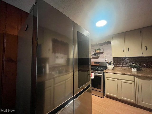 1641 Sharon Ave, Zanesville, OH 43701 - kitchen with light wood-style floors and appliances with stainless steel finishes