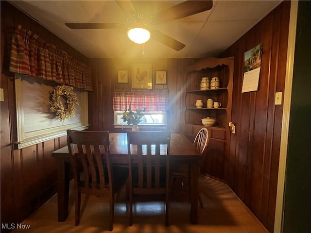 1641 Sharon Ave, Zanesville, OH 43701 - dining area featuring ceiling fan and wooden walls
