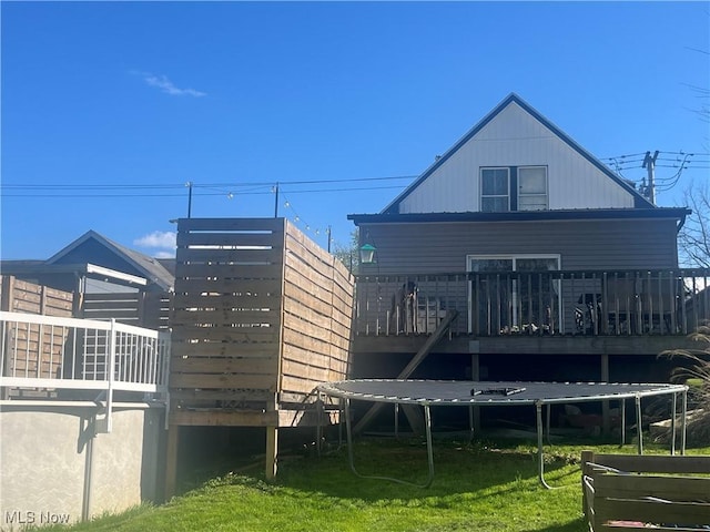1641 Sharon Ave, Zanesville, OH 43701 - rear view of house featuring a wooden deck and a lawn