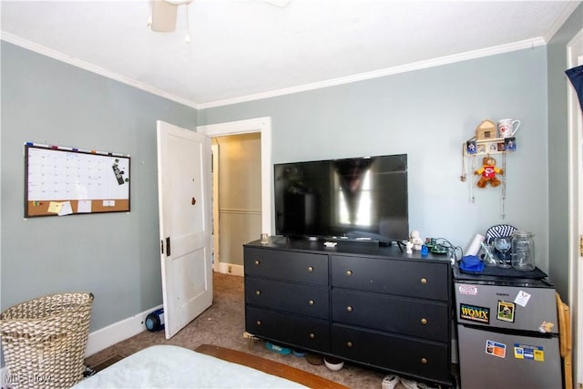 bedroom with a ceiling fan, baseboards, carpet floors, and crown molding