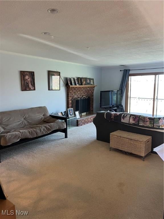 living room with ornamental molding, carpet flooring, a textured ceiling, and a brick fireplace