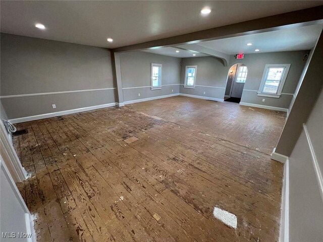 7431 Middlebranch Ave NE, Canton, OH 44721 - unfurnished room featuring arched walkways, baseboards, hardwood / wood-style flooring, and recessed lighting