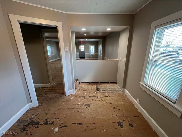7431 Middlebranch Ave NE, Canton, OH 44721 - hallway with plenty of natural light, baseboards, and ornamental molding