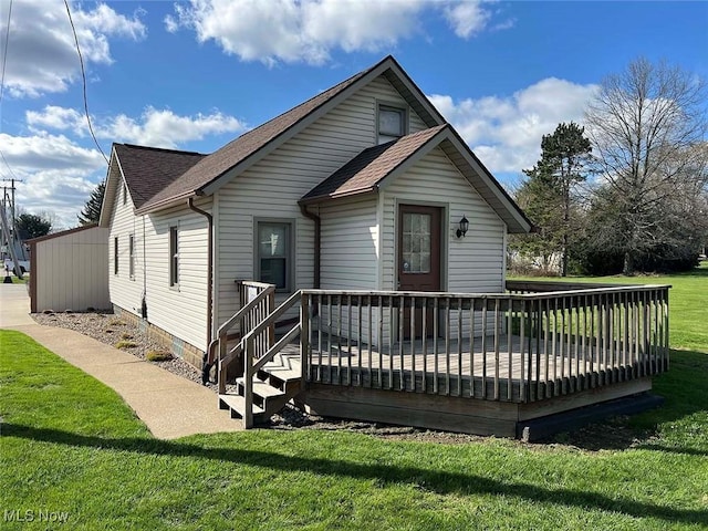 7431 Middlebranch Ave NE, Canton, OH 44721 - rear view of property with a yard, roof with shingles, and a deck