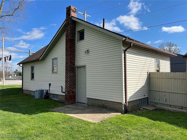 7431 Middlebranch Ave NE, Canton, OH 44721 - view of side of property featuring cooling unit, a lawn, a chimney, and fence