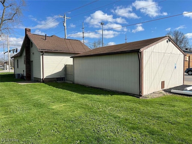 7431 Middlebranch Ave NE, Canton, OH 44721 - view of home's exterior with a lawn, an outdoor structure, central AC unit, and a storage shed