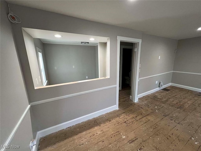 7431 Middlebranch Ave NE, Canton, OH 44721 - unfurnished room with baseboards, hardwood / wood-style floors, and recessed lighting