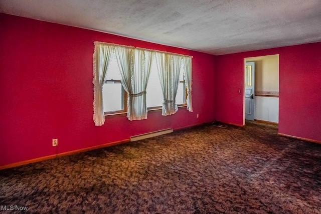 2104 Tanner Ave SW, Canton, OH 44706 - empty room with carpet, a baseboard radiator, a textured ceiling, and plenty of natural light