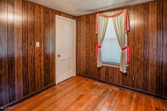 2104 Tanner Ave SW, Canton, OH 44706 - spare room with hardwood / wood-style floors and wooden walls