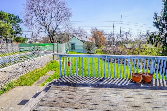 2104 Tanner Ave SW, Canton, OH 44706 - wooden terrace featuring fence and a lawn