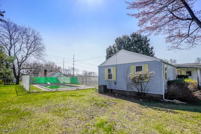 2104 Tanner Ave SW, Canton, OH 44706 - view of property exterior featuring a lawn, fence, and central AC