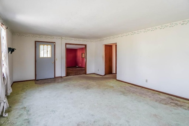 2104 Tanner Ave SW, Canton, OH 44706 - spare room with light carpet and baseboards