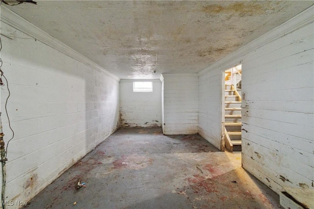 below grade area featuring crown molding