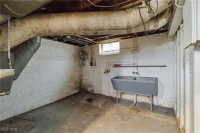 below grade area with a sink