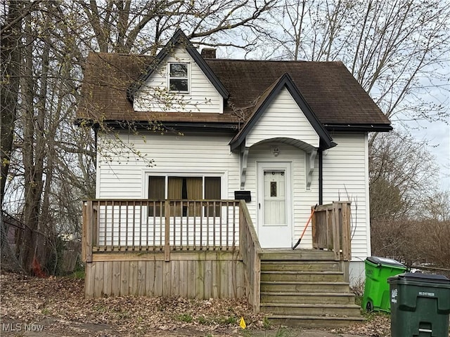262 3rd St NE, Barberton, OH 44203 - view of front of property with roof with shingles and a chimney