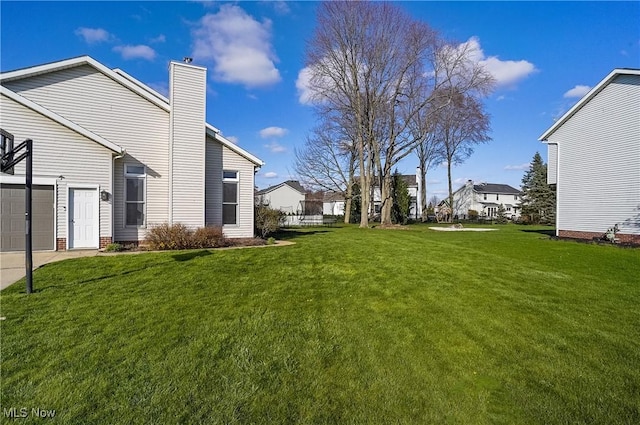 view of yard featuring a garage