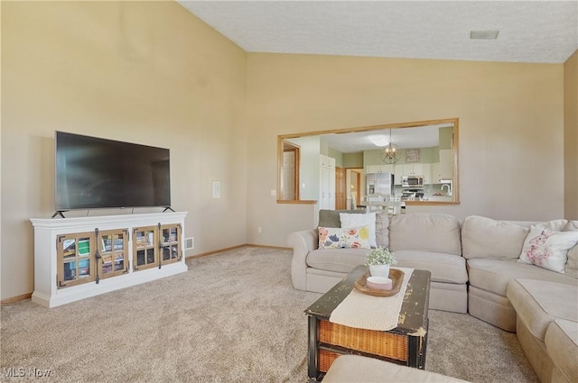carpeted living room with baseboards