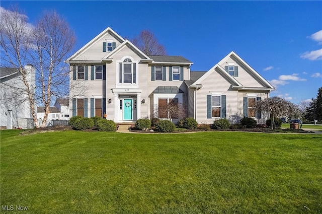 colonial inspired home with a front yard