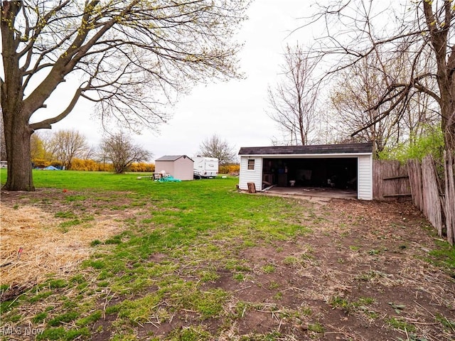 1821 Kenneth Ave, Cleveland, OH 44109 - view of yard with an outdoor structure, fence, and a detached garage
