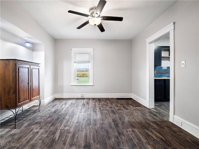 1821 Kenneth Ave, Cleveland, OH 44109 - unfurnished bedroom with baseboards, a ceiling fan, and wood finished floors