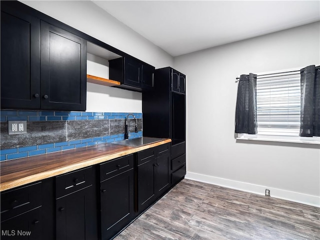 1821 Kenneth Ave, Cleveland, OH 44109 - kitchen with dark cabinets, decorative backsplash, open shelves, and a sink