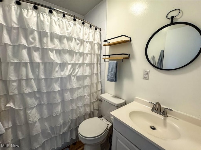 203 57th St, Vienna, WV 26105 - full bath featuring toilet, a shower with curtain, and vanity