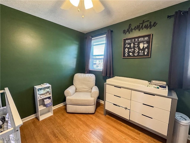 203 57th St, Vienna, WV 26105 - sitting room with ceiling fan, baseboards, wood finished floors, and a textured ceiling