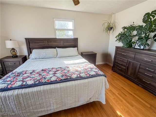 203 57th St, Vienna, WV 26105 - bedroom featuring baseboards and light wood-type flooring