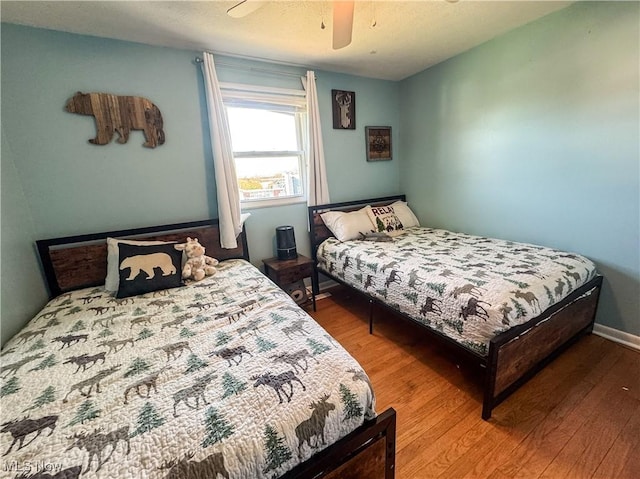 203 57th St, Vienna, WV 26105 - bedroom with wood finished floors and ceiling fan