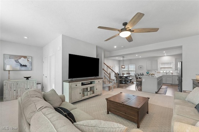 4006 N Steels Cir, Stow, OH 44224 - living room featuring ceiling fan, recessed lighting, and light colored carpet