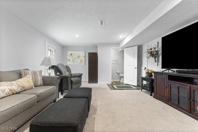 4006 N Steels Cir, Stow, OH 44224 - living area with carpet floors, a textured ceiling, recessed lighting, and baseboards