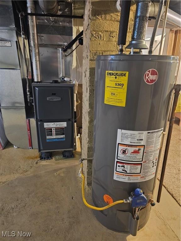 445 N 18th St, Sebring, OH 44672 - utility room featuring heating unit and gas water heater