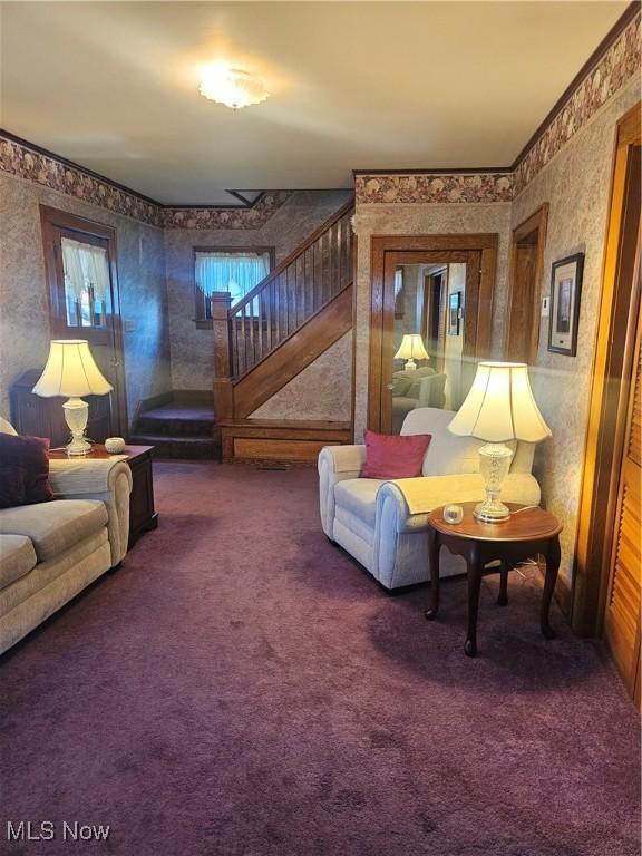 445 N 18th St, Sebring, OH 44672 - carpeted living room with wallpapered walls and stairs