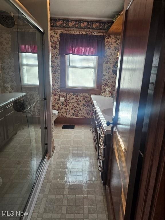 445 N 18th St, Sebring, OH 44672 - bathroom with a stall shower, wallpapered walls, vanity, and a healthy amount of sunlight