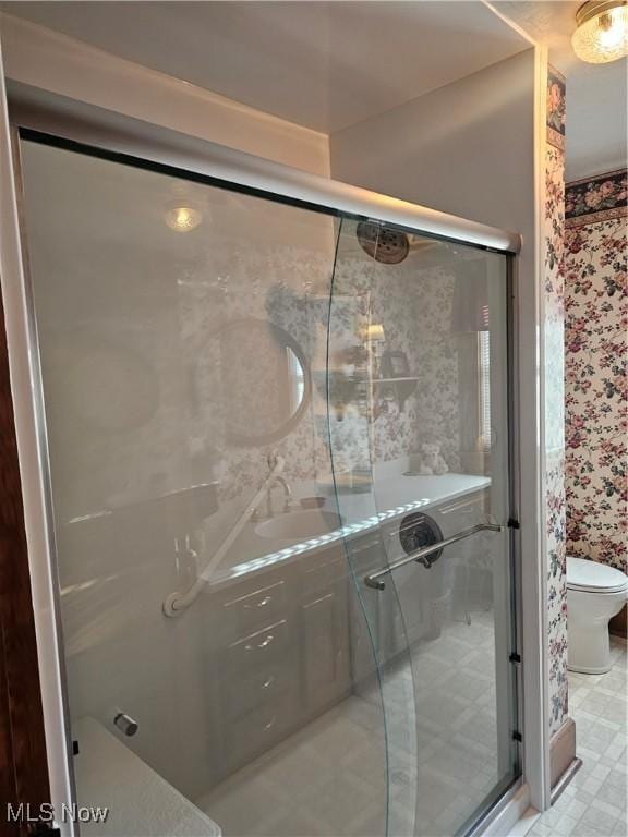 445 N 18th St, Sebring, OH 44672 - bathroom with toilet, a sink, wallpapered walls, and a stall shower