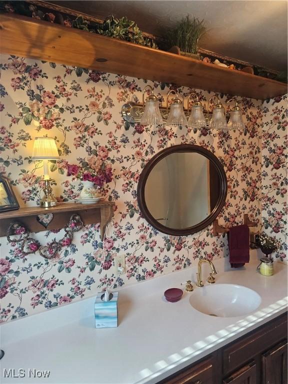 445 N 18th St, Sebring, OH 44672 - bathroom with vanity and wallpapered walls