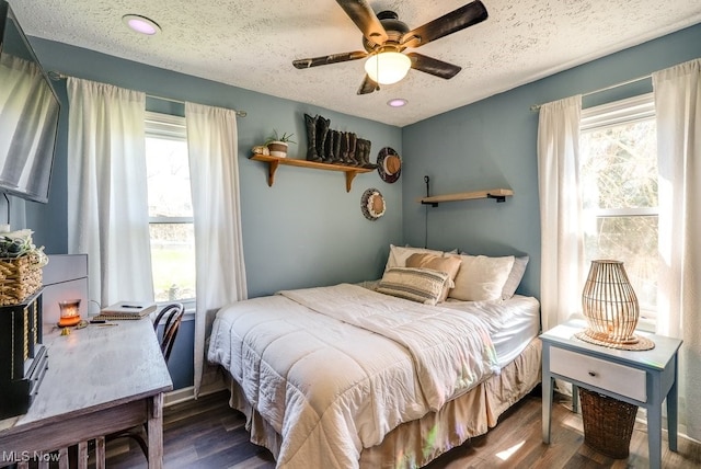 1865 9th St SW, Akron, OH 44314 - bedroom with a ceiling fan, wood finished floors, and a textured ceiling