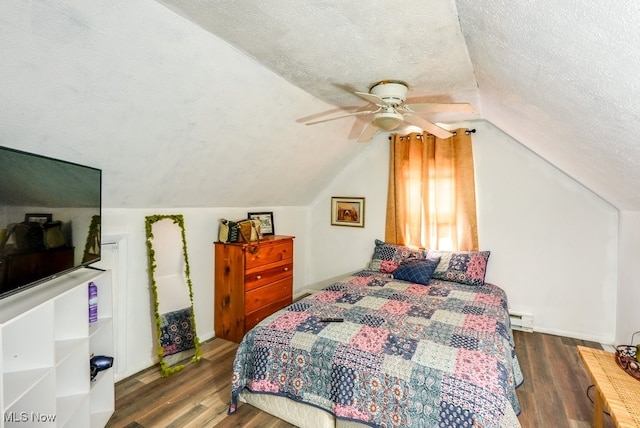 1865 9th St SW, Akron, OH 44314 - bedroom featuring vaulted ceiling, a ceiling fan, wood finished floors, and a textured ceiling