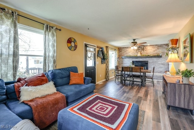 1865 9th St SW, Akron, OH 44314 - living area featuring plenty of natural light, ceiling fan, wood finished floors, and a fireplace