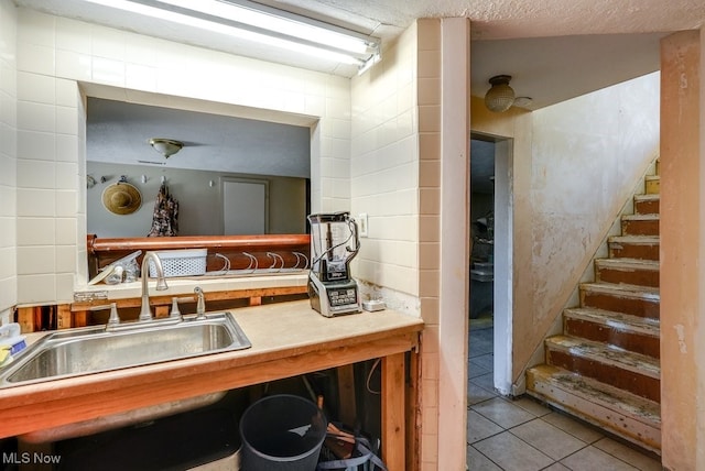 1865 9th St SW, Akron, OH 44314 - kitchen with tile patterned floors and a sink